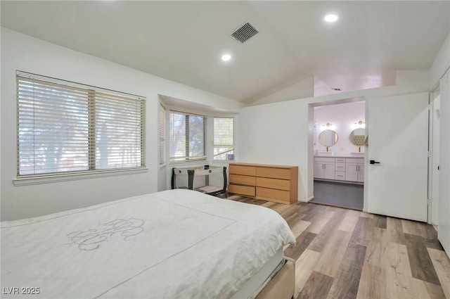 8404 Shore Breeze Dr, Las Vegas, NV 89128 - bedroom with vaulted ceiling, light wood finished floors, ensuite bath, and recessed lighting
