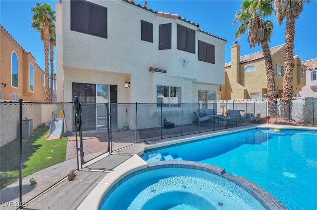 8404 Shore Breeze Dr, Las Vegas, NV 89128 - view of pool with a patio area, a pool with connected hot tub, and a fenced backyard