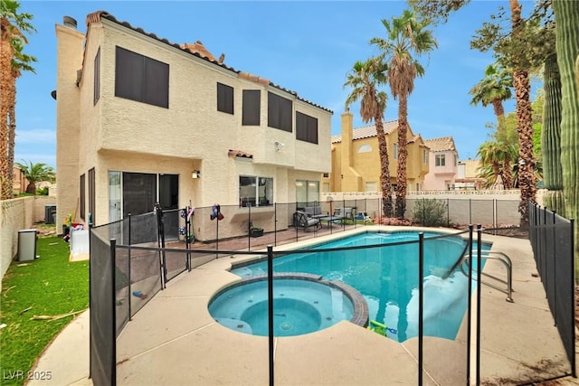8404 Shore Breeze Dr, Las Vegas, NV 89128 - view of swimming pool with a pool with connected hot tub, a patio area, and a fenced backyard