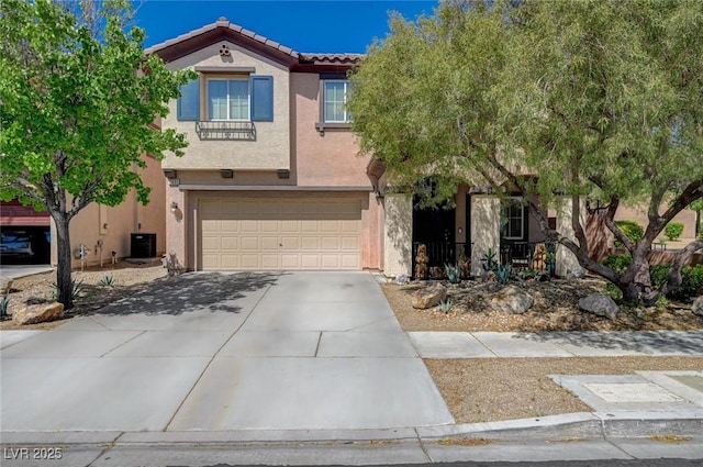7651 Anatolian St, Las Vegas, NV 89166 - view of front of home featuring concrete driveway, a tiled roof, an attached garage, and stucco siding