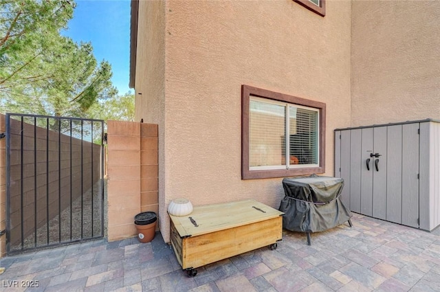 7651 Anatolian St, Las Vegas, NV 89166 - view of patio featuring fence and a gate