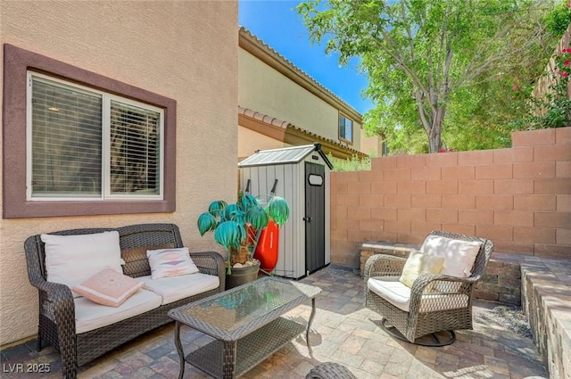7651 Anatolian St, Las Vegas, NV 89166 - view of patio with an outbuilding, fence, and a storage shed