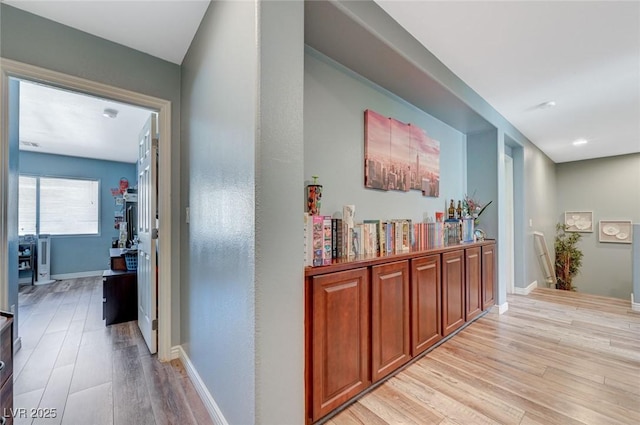 7651 Anatolian St, Las Vegas, NV 89166 - hallway featuring baseboards and light wood-style flooring