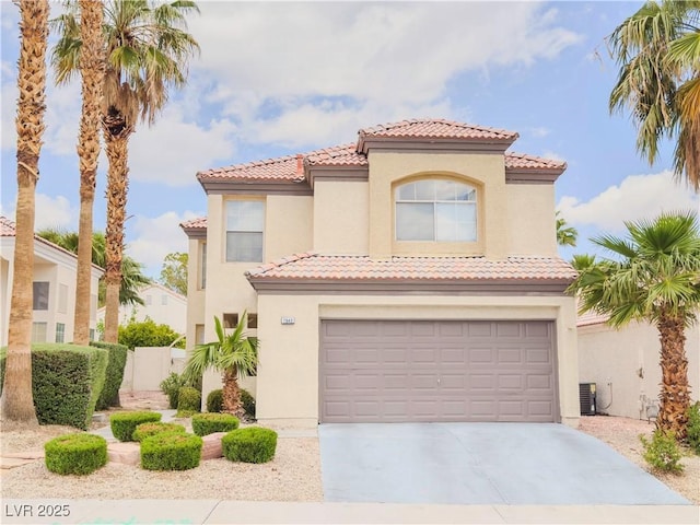 7840 Millhopper Ave, Las Vegas, NV 89128 - mediterranean / spanish house featuring an attached garage, a tiled roof, stucco siding, and driveway