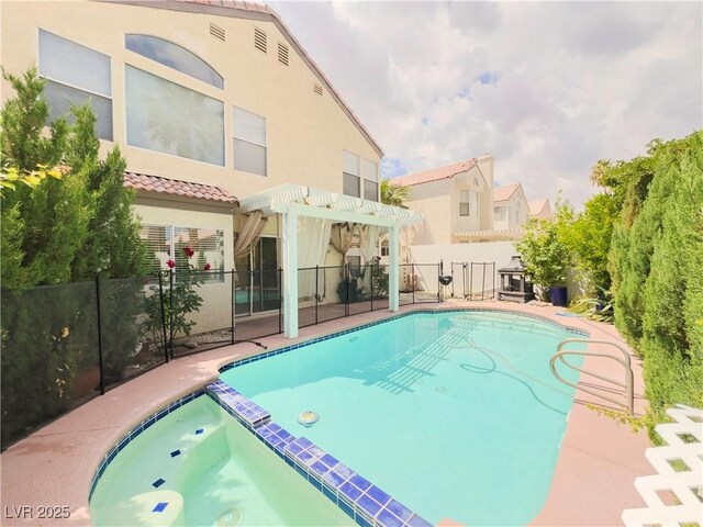 7840 Millhopper Ave, Las Vegas, NV 89128 - view of pool with a pergola, a pool with connected hot tub, and fence