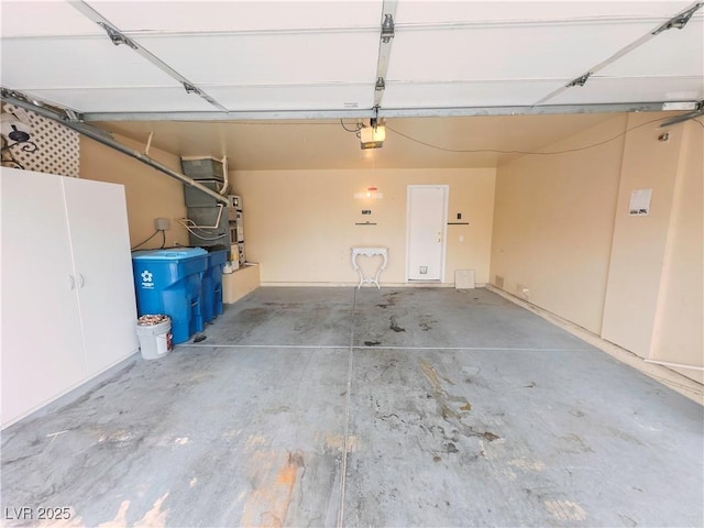 7840 Millhopper Ave, Las Vegas, NV 89128 - garage featuring a garage door opener