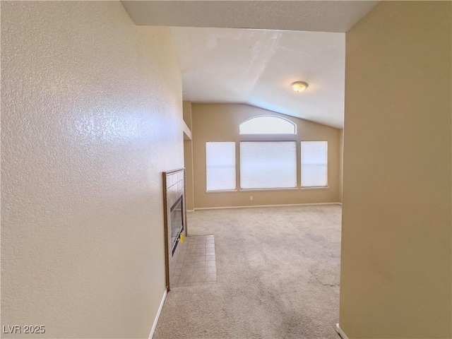 7840 Millhopper Ave, Las Vegas, NV 89128 - hall featuring lofted ceiling, carpet flooring, and baseboards
