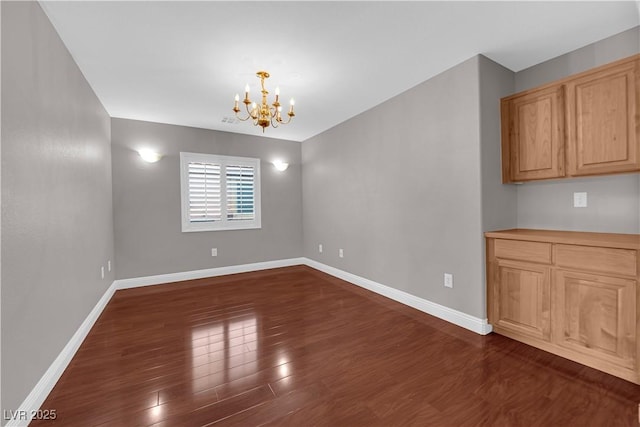 unfurnished dining area with baseboards, dark wood-style floors, and a notable chandelier