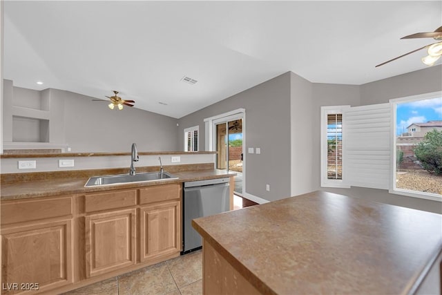 kitchen featuring dishwasher, a wealth of natural light, a ceiling fan, and a sink