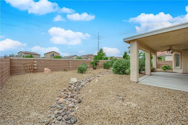 view of yard featuring a patio and a fenced backyard
