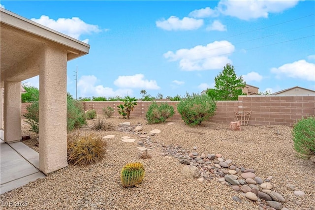 view of yard with a fenced backyard