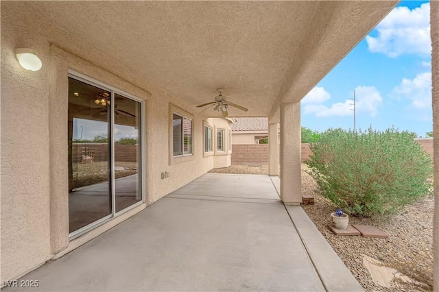 view of patio with a fenced backyard and ceiling fan