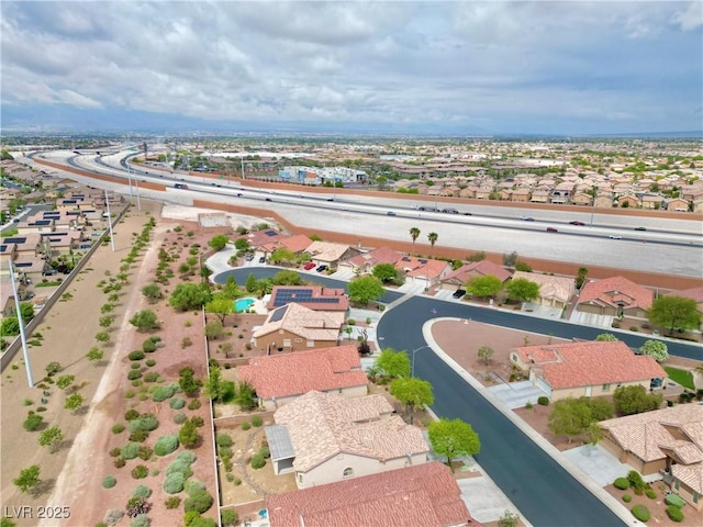 birds eye view of property with a residential view