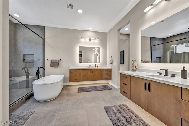 819 Bolide St, Las Vegas, NV 89138 - full bathroom featuring a stall shower, two vanities, a freestanding tub, baseboards, and recessed lighting