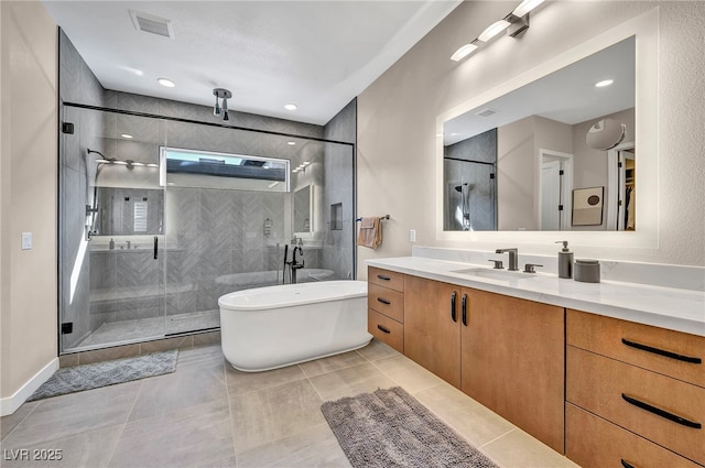 819 Bolide St, Las Vegas, NV 89138 - bathroom featuring a stall shower, vanity, a soaking tub, and tile patterned flooring