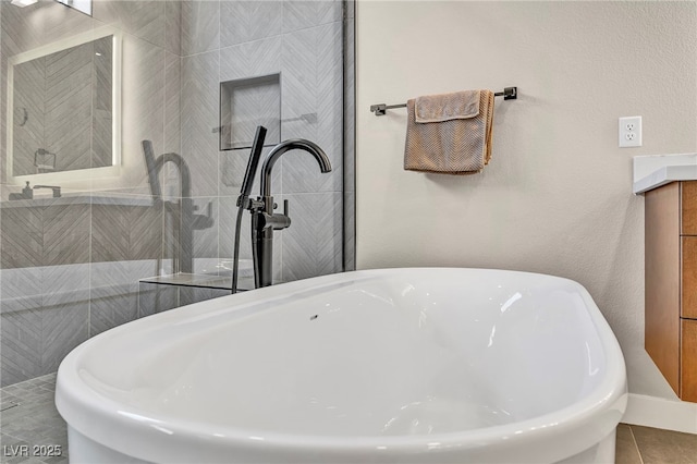 819 Bolide St, Las Vegas, NV 89138 - bathroom featuring a soaking tub, a tile shower, vanity, and tile patterned floors