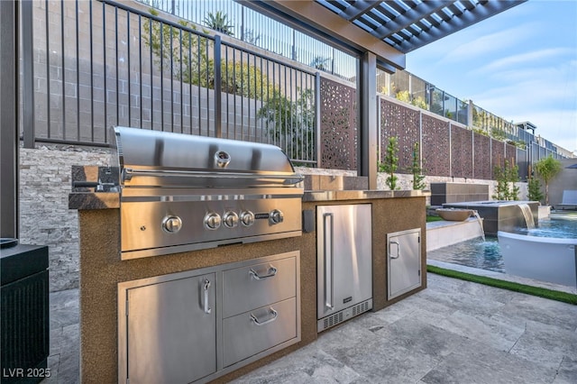 819 Bolide St, Las Vegas, NV 89138 - view of patio with a grill, exterior kitchen, fence, and a hot tub
