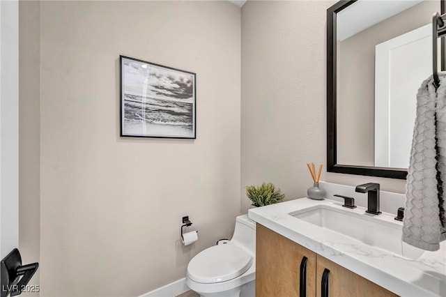 819 Bolide St, Las Vegas, NV 89138 - bathroom with toilet, vanity, and baseboards