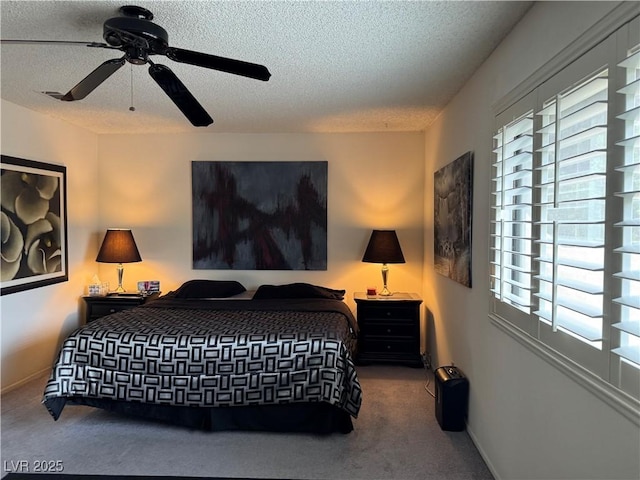 4662 Kelly Barry Way, Las Vegas, NV 89121 - bedroom featuring multiple windows, a textured ceiling, ceiling fan, and carpet floors