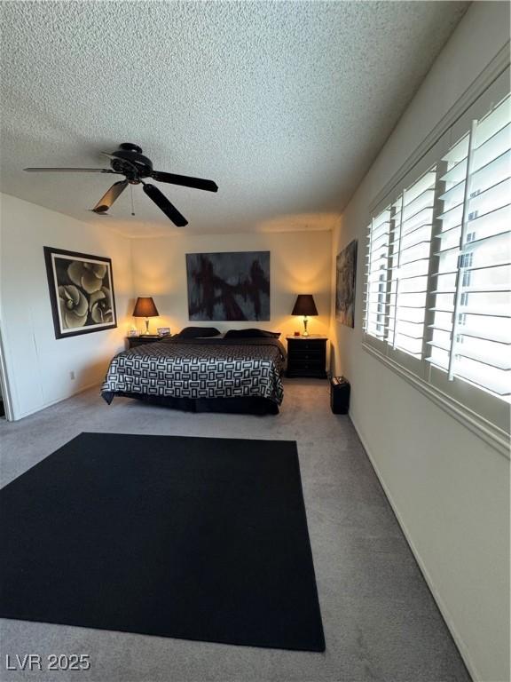 4662 Kelly Barry Way, Las Vegas, NV 89121 - bedroom featuring carpet flooring, a textured ceiling, and ceiling fan