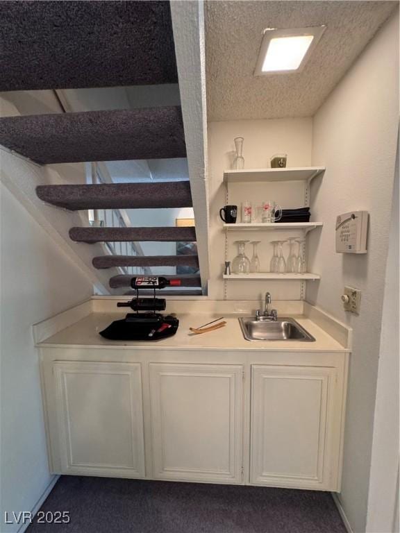4662 Kelly Barry Way, Las Vegas, NV 89121 - bar featuring wet bar, a textured ceiling, dark colored carpet, and a sink