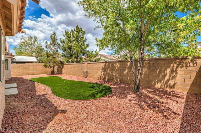 8664 Frasure Falls Ave, Las Vegas, NV 89178 - view of yard featuring a fenced backyard