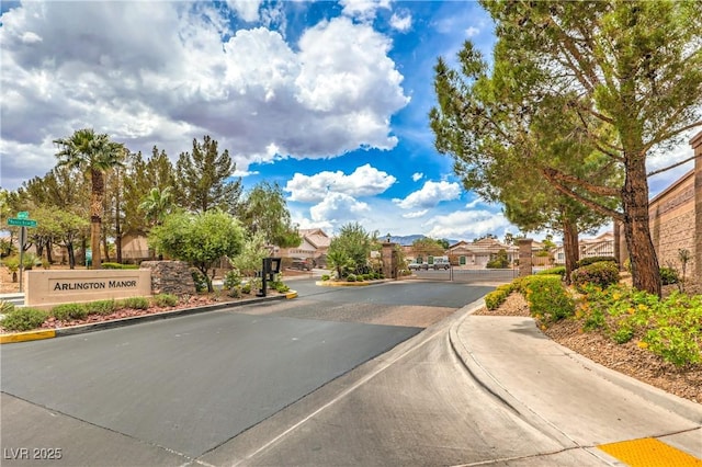 8664 Frasure Falls Ave, Las Vegas, NV 89178 - view of street featuring a gated entry, a residential view, and curbs