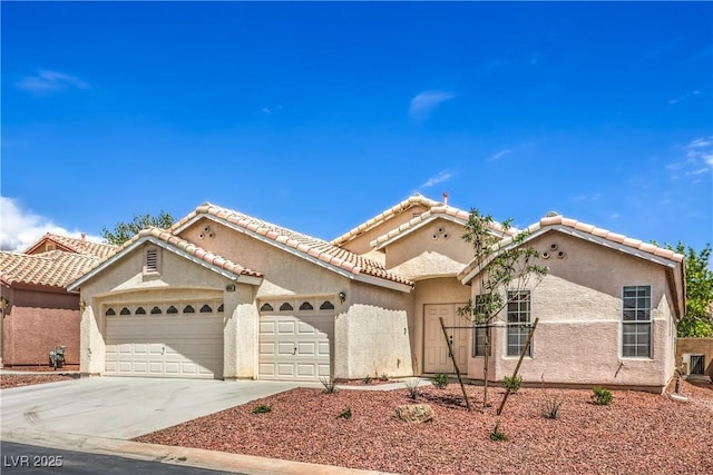 8664 Frasure Falls Ave, Las Vegas, NV 89178 - mediterranean / spanish-style house featuring a tile roof, a garage, stucco siding, and driveway