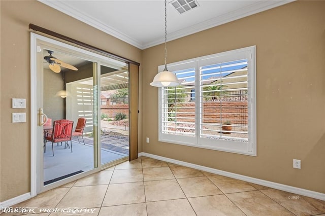 interior space featuring light tile patterned floors, visible vents, baseboards, ceiling fan, and ornamental molding
