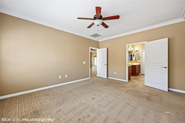 unfurnished bedroom featuring baseboards, ornamental molding, visible vents, connected bathroom, and light colored carpet