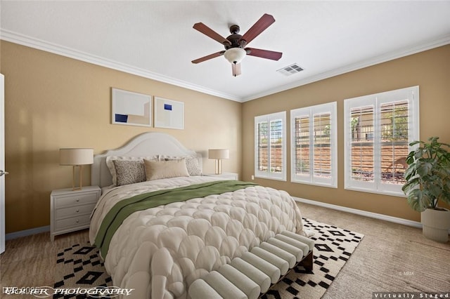 bedroom featuring baseboards, multiple windows, ornamental molding, and visible vents