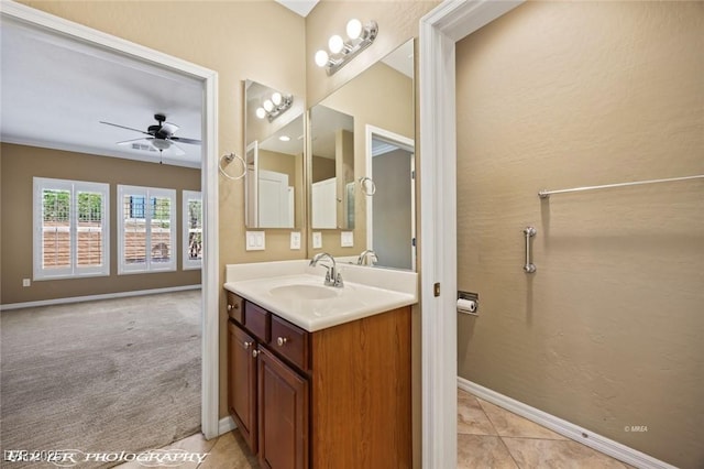 bathroom featuring vanity, baseboards, a ceiling fan, and tile patterned flooring
