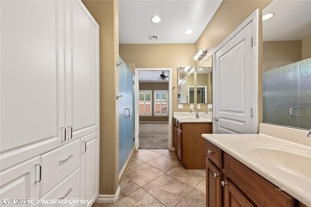 full bathroom with a ceiling fan, visible vents, baseboards, a shower stall, and tile patterned flooring