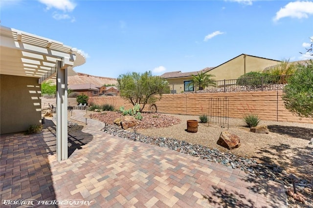 view of patio with a pergola and a fenced backyard