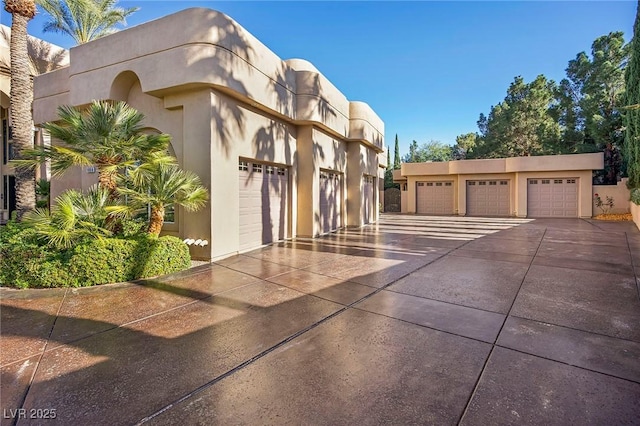 1008 Trophy Hills Dr, Las Vegas, NV 89134 - view of front of property with community garages and stucco siding