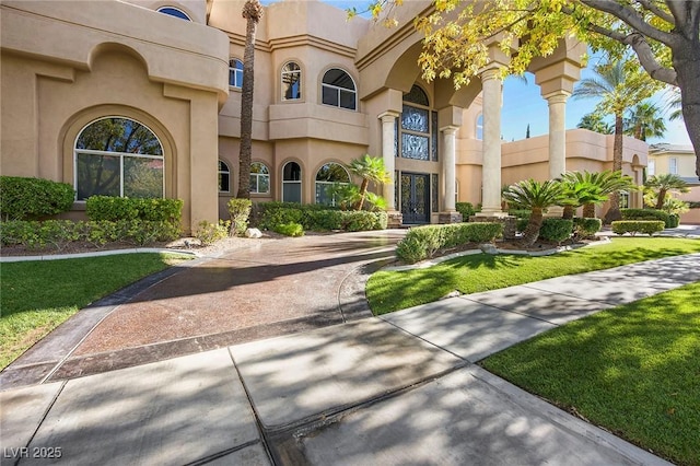 1008 Trophy Hills Dr, Las Vegas, NV 89134 - exterior space with stucco siding, french doors, and a lawn