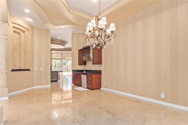 1008 Trophy Hills Dr, Las Vegas, NV 89134 - interior space featuring baseboards, dark countertops, a tray ceiling, and stainless steel dishwasher