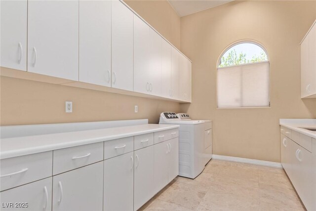 1008 Trophy Hills Dr, Las Vegas, NV 89134 - laundry area featuring cabinet space, separate washer and dryer, and baseboards