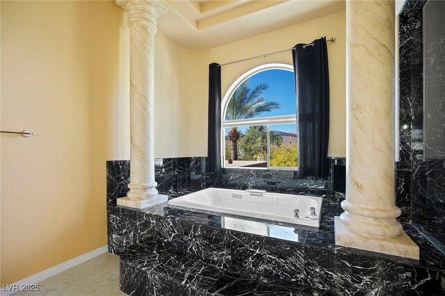 1008 Trophy Hills Dr, Las Vegas, NV 89134 - full bath with a bath, baseboards, and decorative columns