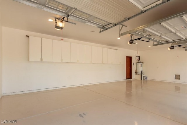 1008 Trophy Hills Dr, Las Vegas, NV 89134 - garage featuring water heater and a garage door opener