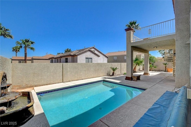view of pool with a patio area, a fenced in pool, and a fenced backyard