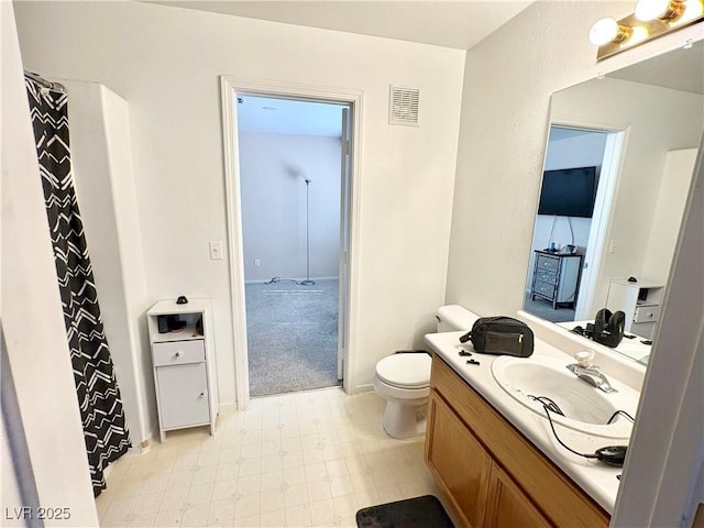5024 Starfinder Ave, Las Vegas, NV 89108 - bathroom featuring tile patterned floors, toilet, and vanity