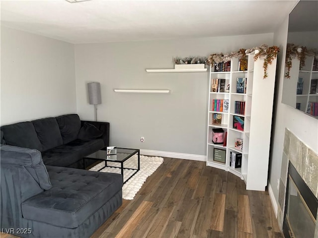 5024 Starfinder Ave, Las Vegas, NV 89108 - living room featuring wood finished floors, baseboards, and a glass covered fireplace