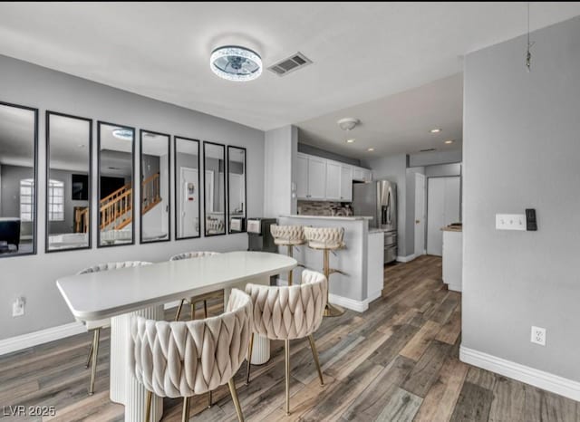 5024 Starfinder Ave, Las Vegas, NV 89108 - dining room featuring baseboards, dark wood finished floors, and recessed lighting