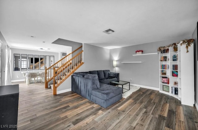 5024 Starfinder Ave, Las Vegas, NV 89108 - living area with stairway, wood finished floors, and baseboards