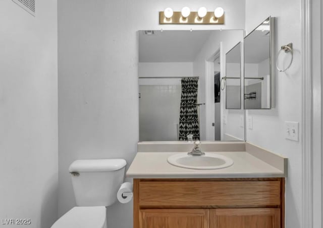 5024 Starfinder Ave, Las Vegas, NV 89108 - bathroom featuring toilet, vanity, and a shower with curtain