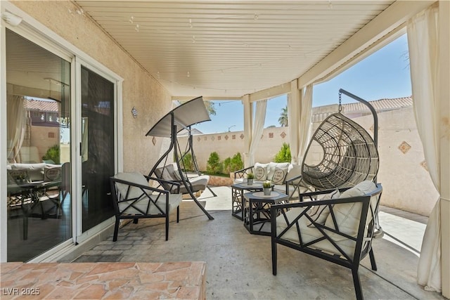 view of patio with outdoor lounge area and a fenced backyard