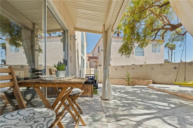 view of patio featuring outdoor dining area