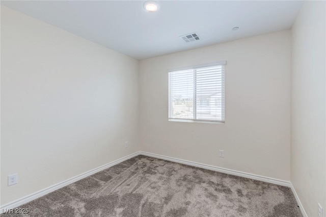 unfurnished room featuring carpet, baseboards, and visible vents