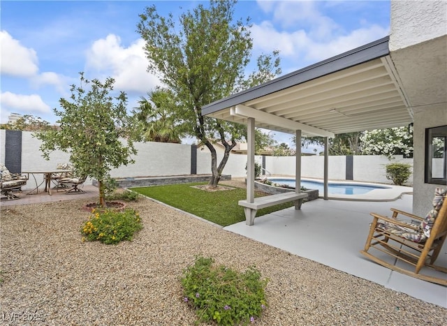 exterior space with a patio area, a fenced in pool, and a fenced backyard
